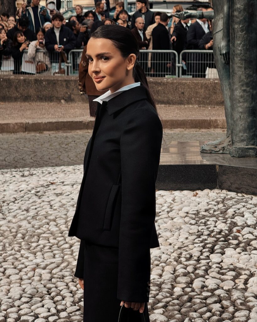 Dina Saeva at the Miu Miu show during Paris Fashion Week 2024.