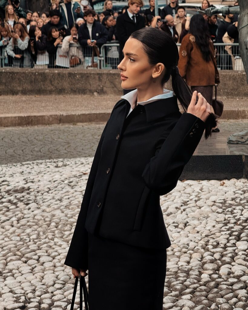 Dina Saeva at the Miu Miu show during Paris Fashion Week 2024.