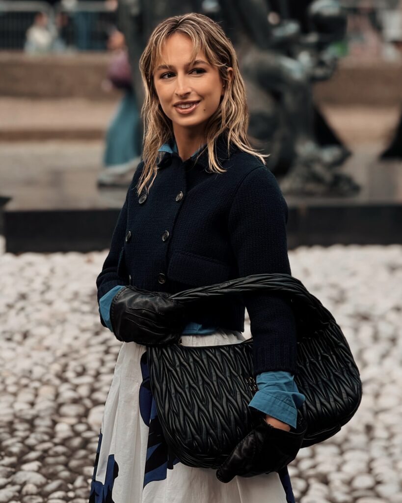 IZZI at the Miu Miu show during Paris Fashion Week 2024.