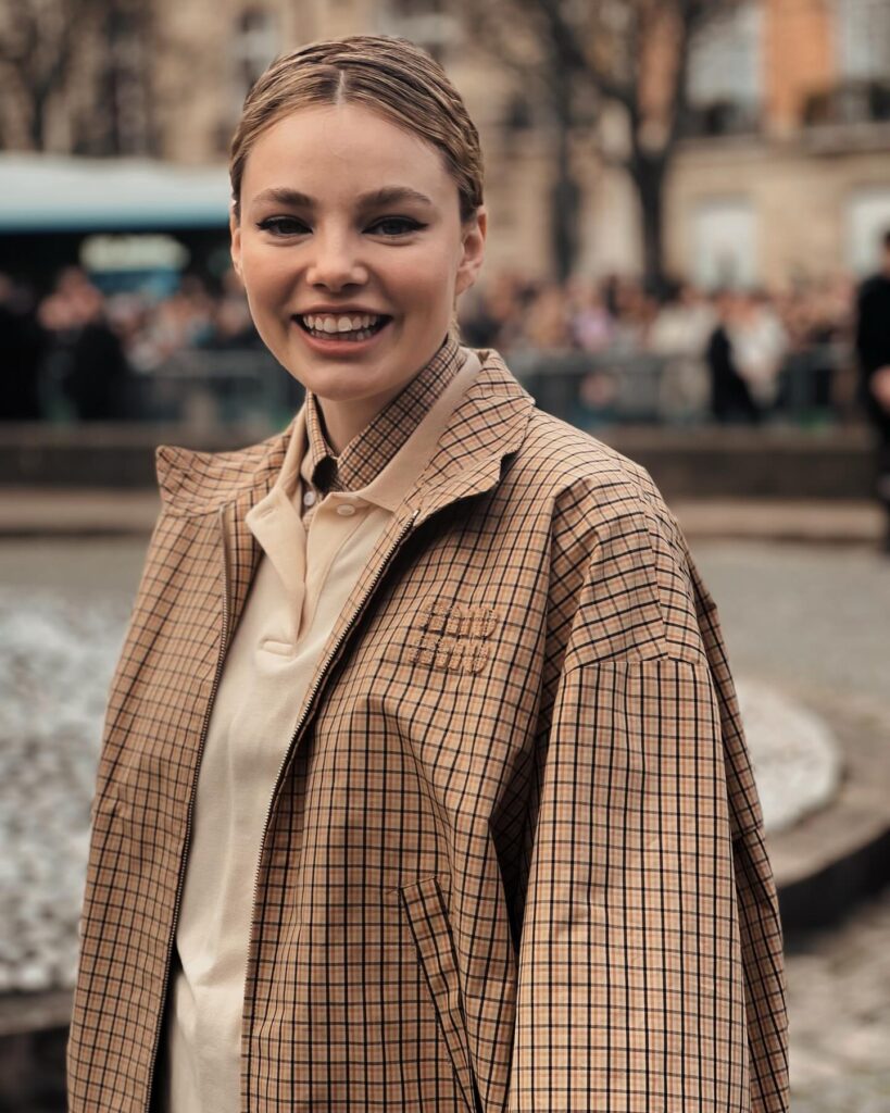 Kristine Froseth at the Miu Miu show during Paris Fashion Week 2024.