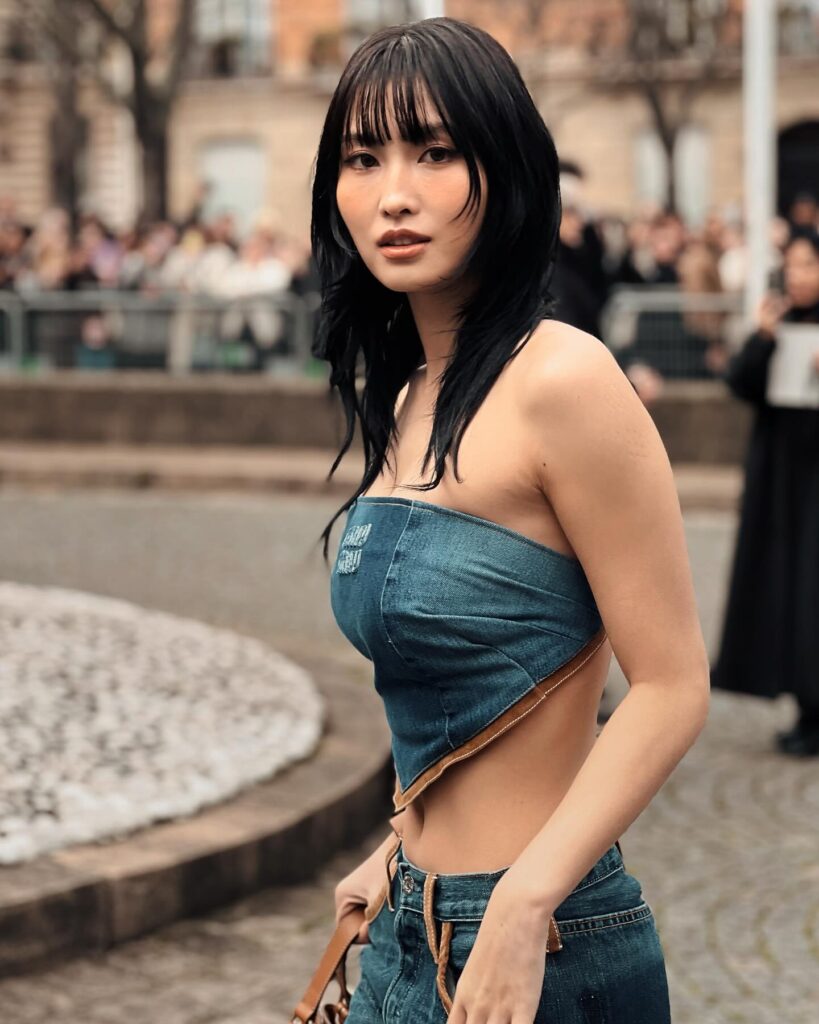 Momo at the Miu Miu show during Paris Fashion Week 2024.
